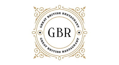 The image shows a logo with the letters "GBR" in bold, black font at the center. Surrounding the letters is a decorative circular frame with gold ornamental designs. The words "Global British Restaurant" are written in a circular pattern around the frame.