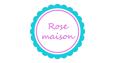 الشعار يوضح "روز ميزود" باللون الوردي والخلفيه بيضاء