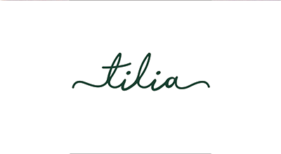 الشعار يوضح "Tilia Restaurant " باللون الاخضر والخلفيه بيضاء