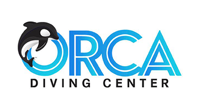 The image features a logo for "ORCA DIVING CENTER." The design incorporates an orca (killer whale) leaping through the letter "O" in "ORCA." The text is in a bold, representing the ocean and diving theme. The words "DIVING CENTER" are written in a smaller